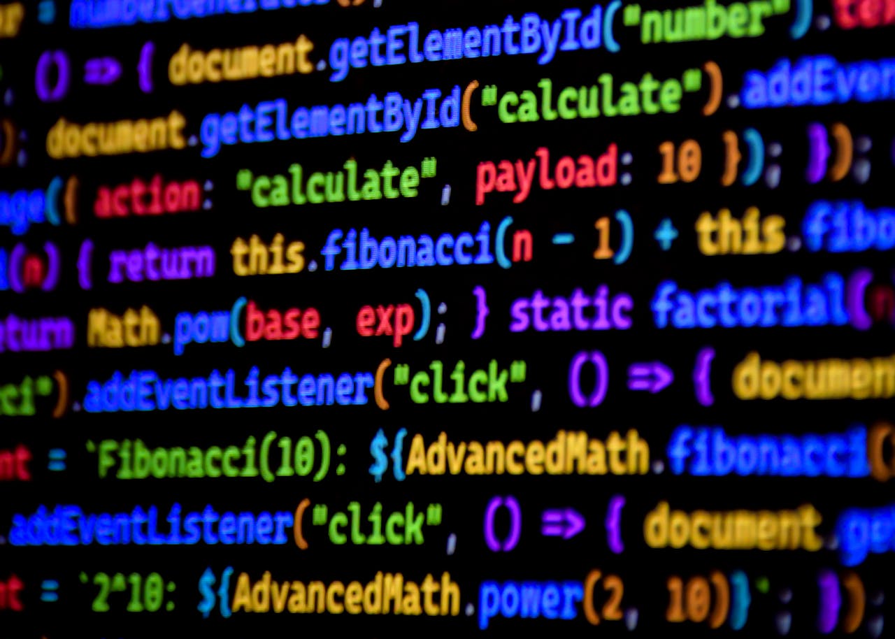 Mastering the First Impression: Your intriguing post title goes here Bright and colorful JavaScript code displayed on a computer screen, showcasing programming.